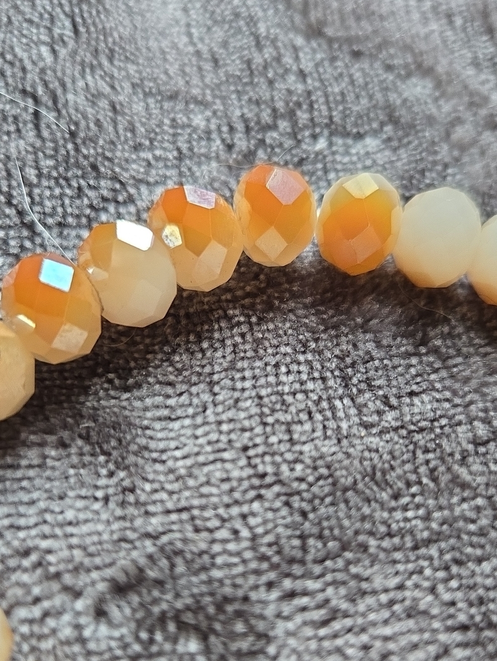 Stretchy Faceted Orange & Cream Beaded Stretch Bracelet with Gold Charm Dangle - Picture 2 of 4